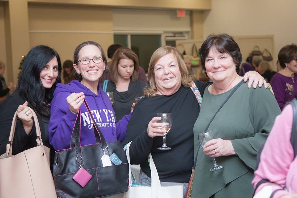Shoppers support Wood Library while enjoying Pursapalooza
